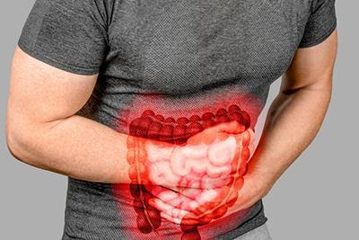 illustration of intestines over man's stomach
