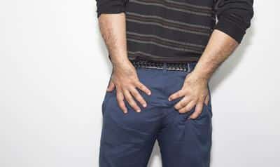 man grabbing butt
